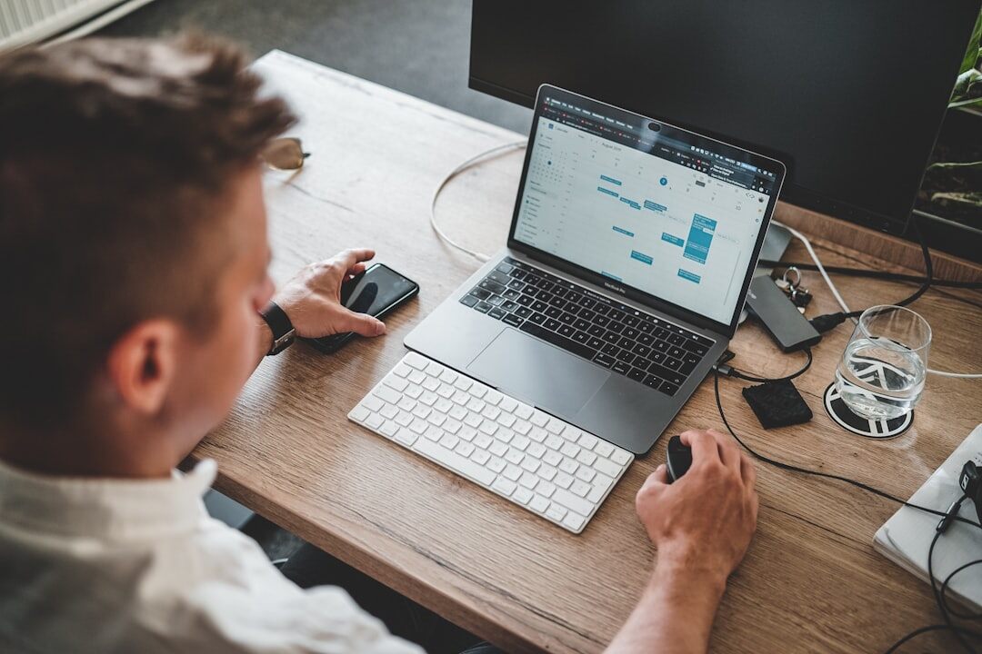 person planning budget on laptop