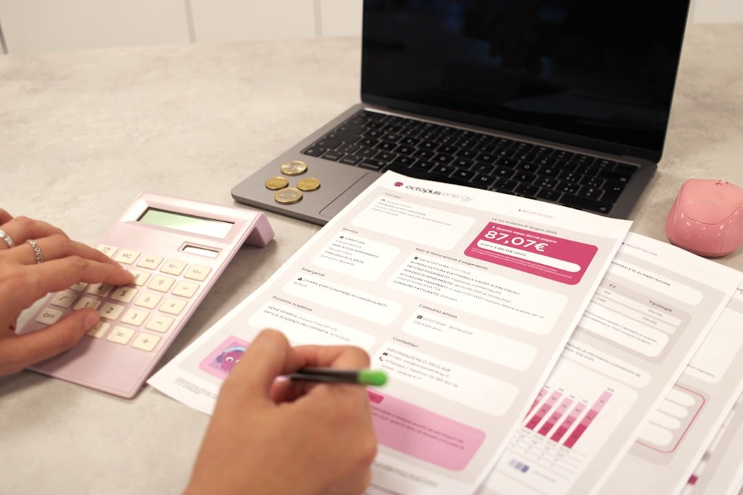 woman tracking expenses in notebook