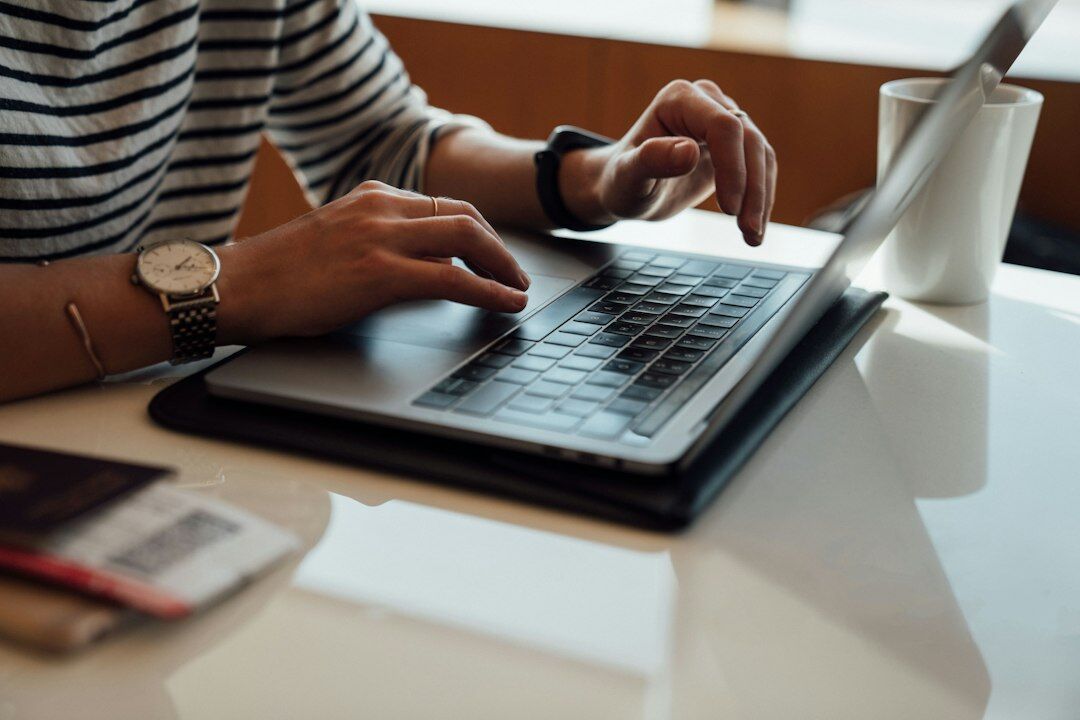 person reviewing budget on laptop