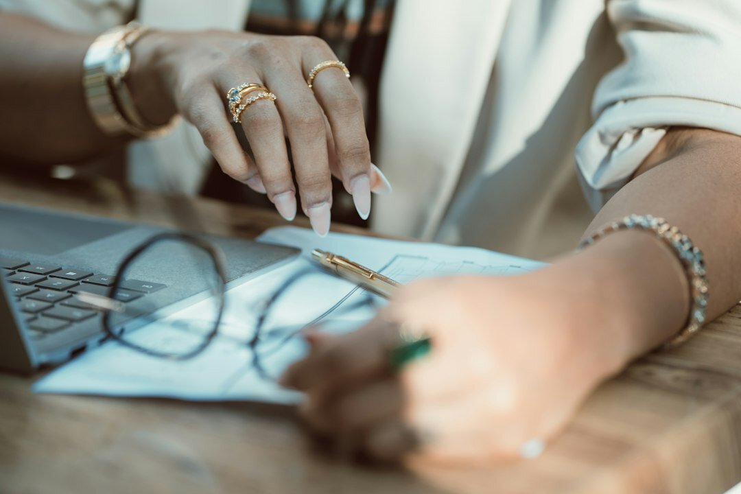 woman writing financial goals