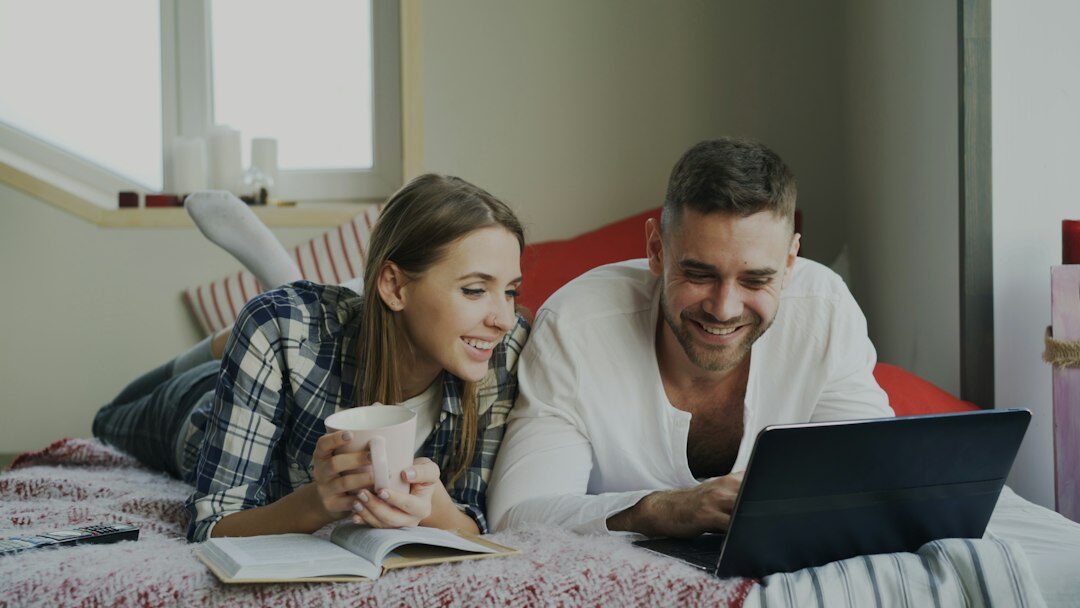 couple smiling with financial documents