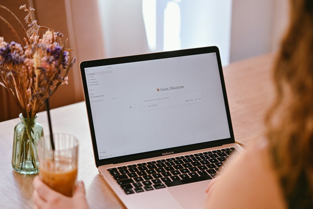 woman tracking expenses on laptop
